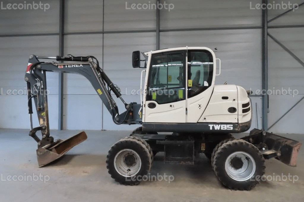 Pelle sur pneus Terex tx 85